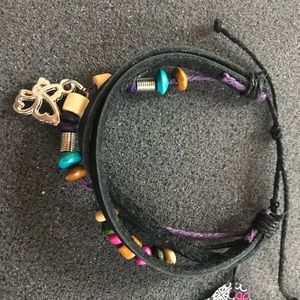 Four layer bracelet with butterfly charm